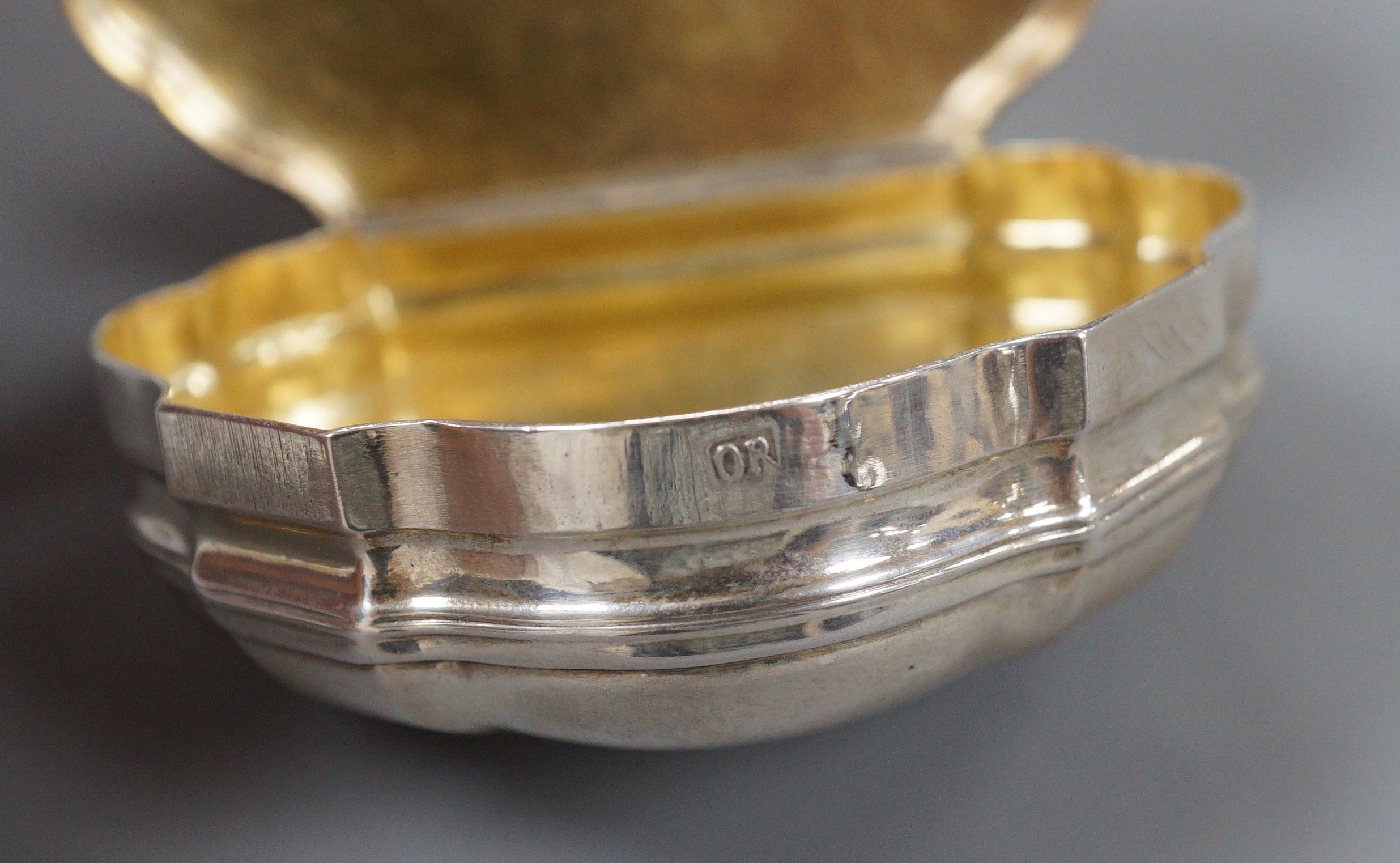 A late 18th/early 19th century white metal shaped demi-lune snuff box, makers mark, OR, 7cm, 69.5 grams.